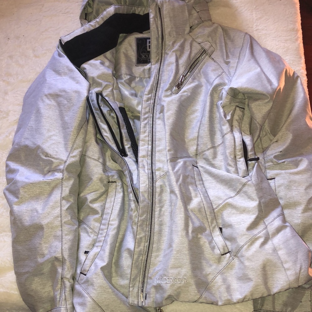Snowboard/ Ski jacket with hood and hand holes. Worn for one season